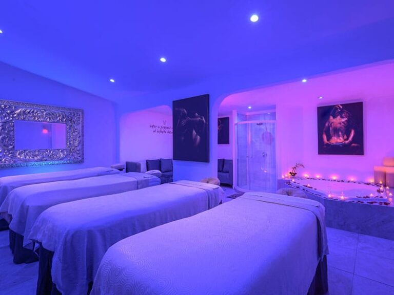 a room with beds and a bathtub