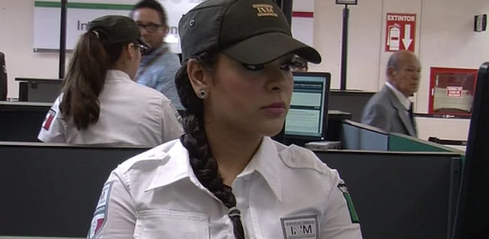 Immigration officer at an airport passport-control desk