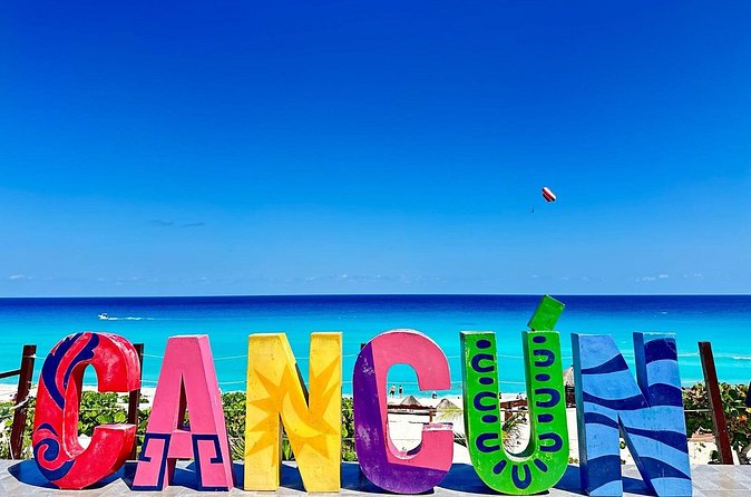 Colourful Cancun letters overlooking the Caribbean at Playa Delfines