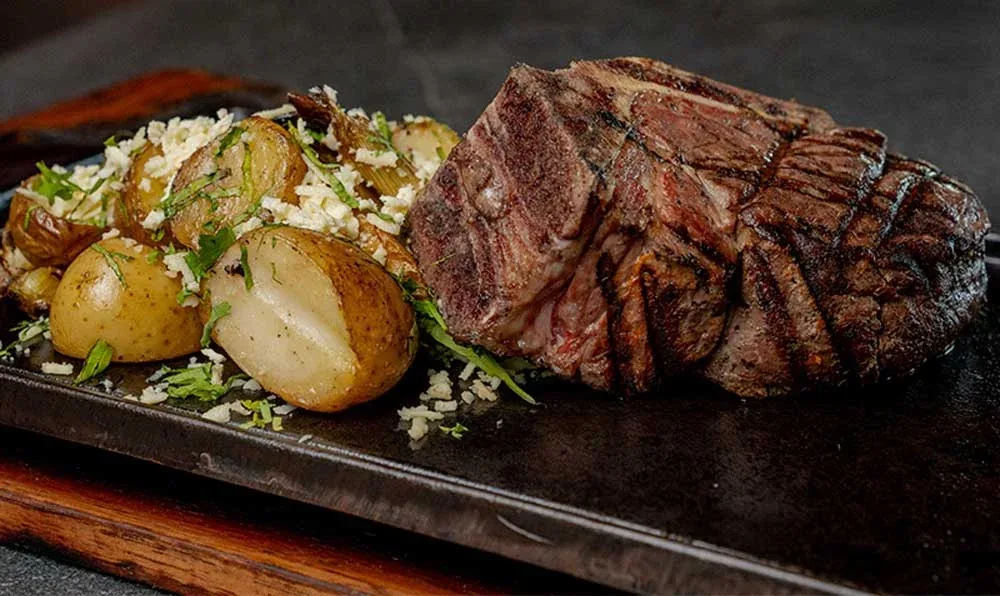 Grilled steak and potatoes at Porfirio’s Cancun