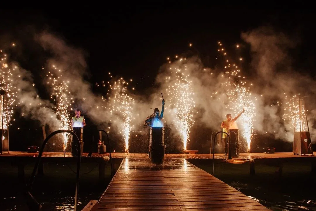 Performers with sparklers by the lagoon at Rosa Negra Cancun