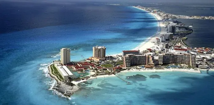 Aerial view of Cancun’s hotel-lined coastline and turquoise sea
