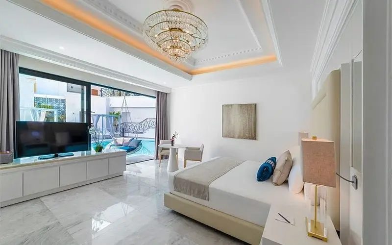 Living area and pool access in a Desire Mansion Swim-Up Suite