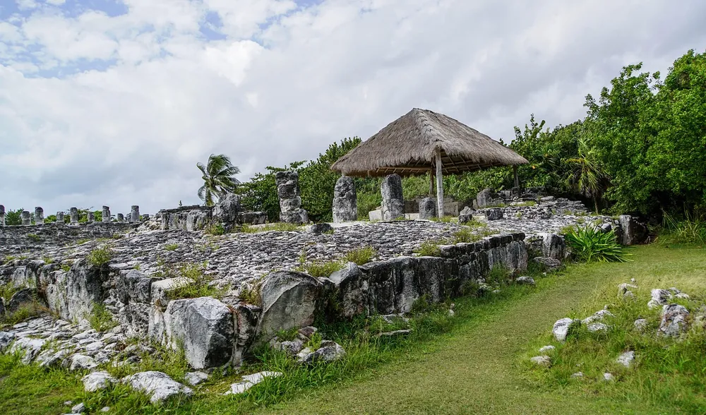 Stone platforms and columns at the El Rey Maya ruins in Cancun