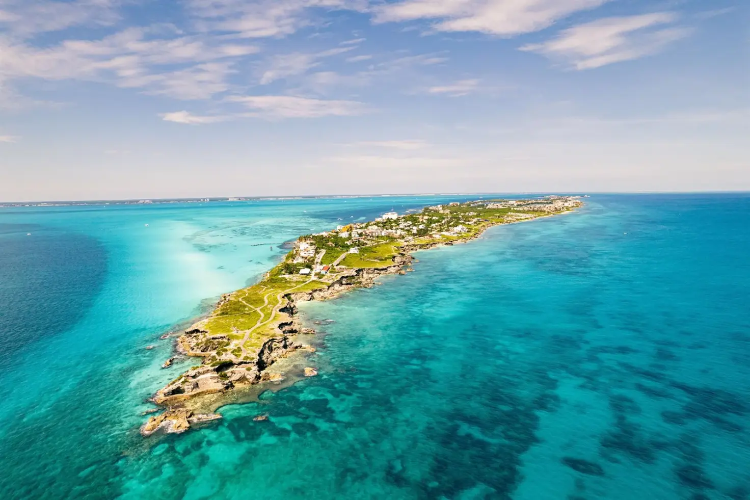 Aerial view of Isla Mujeres stretching into turquoise Caribbean water