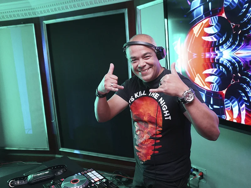 A DJ playing music in Desire Cruises’ official experience gallery