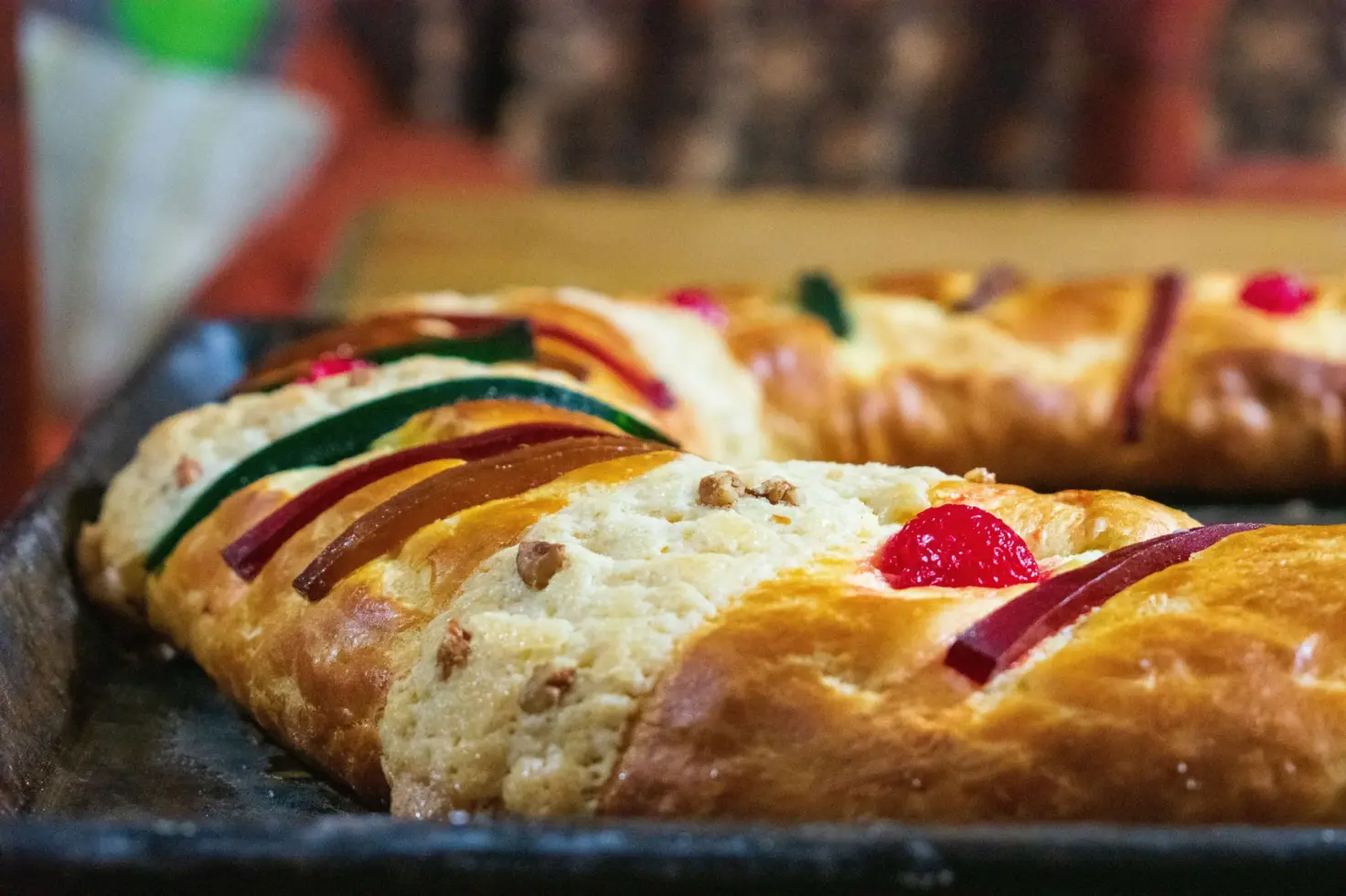 Rosca de Reyes decorated with colorful candied fruit