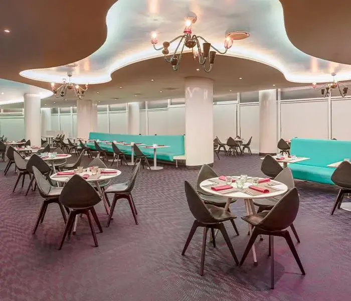Tables set for dining inside Amores Mexican buffet at Temptation Cancun Resort