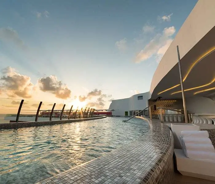 Rooftop pool, loungers and ocean view at SKY 3.5 in Temptation Cancun Resort