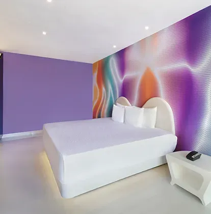 Trendy room with a king-size bed at Temptation Cancun Resort