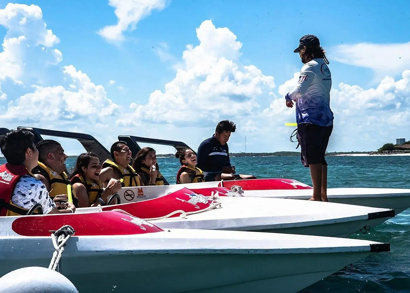 Jungle Tour guide briefing guests in small speedboats on the water