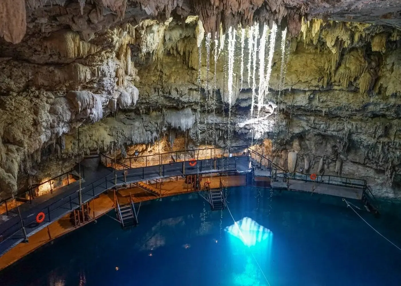 Blue water and limestone walls at Cenote Chukum