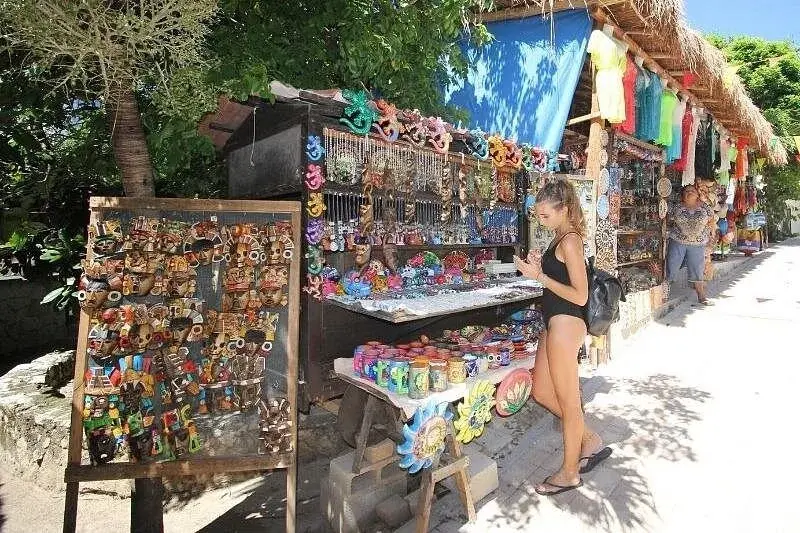 Colourful souvenir stalls beside a walkway on Isla Mujeres